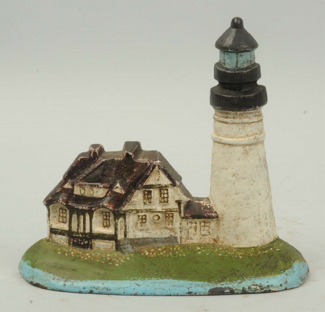 Cast Iron Lighthouse with Keepers House Doorstop.: Contemporary. Condition (Very Good). Size 6 - 1/2" T.
