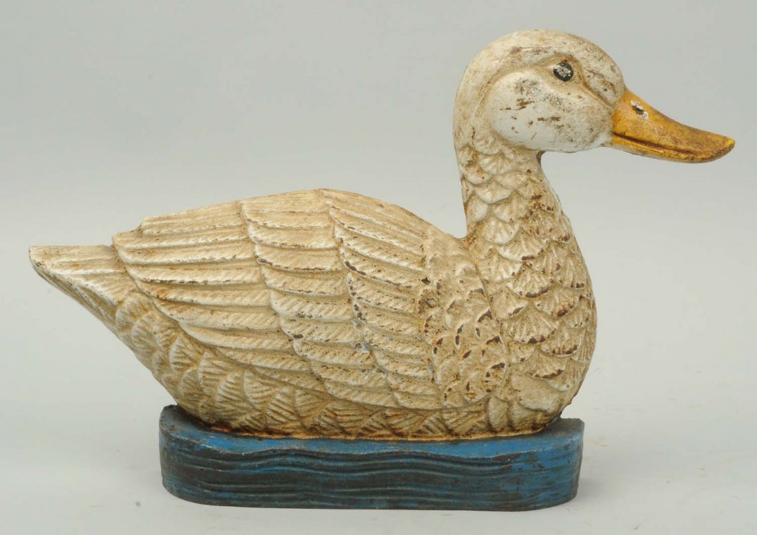 Cast Iron Duck Doorstop.: Contemporary. Showing duck swimming in water. Condition (Good). Size 12" L.