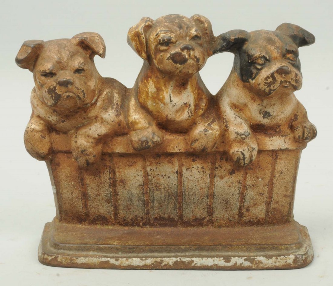 Cast Iron Bulldogs in Barrel Doorstop.: Marked, "Steacy & Wilton Co., Wrightsville, PA. Copyright 1932, Rosenstein, Lancaster, Pennsylvania. USA." Condition (Good). Size 6 - 1/2" T.