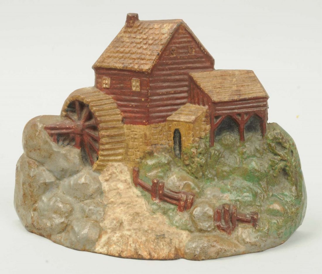 Cast Iron Mill Doorstop.: Reproduction. Condition (Very Good). Size 6 - 5/8" T.