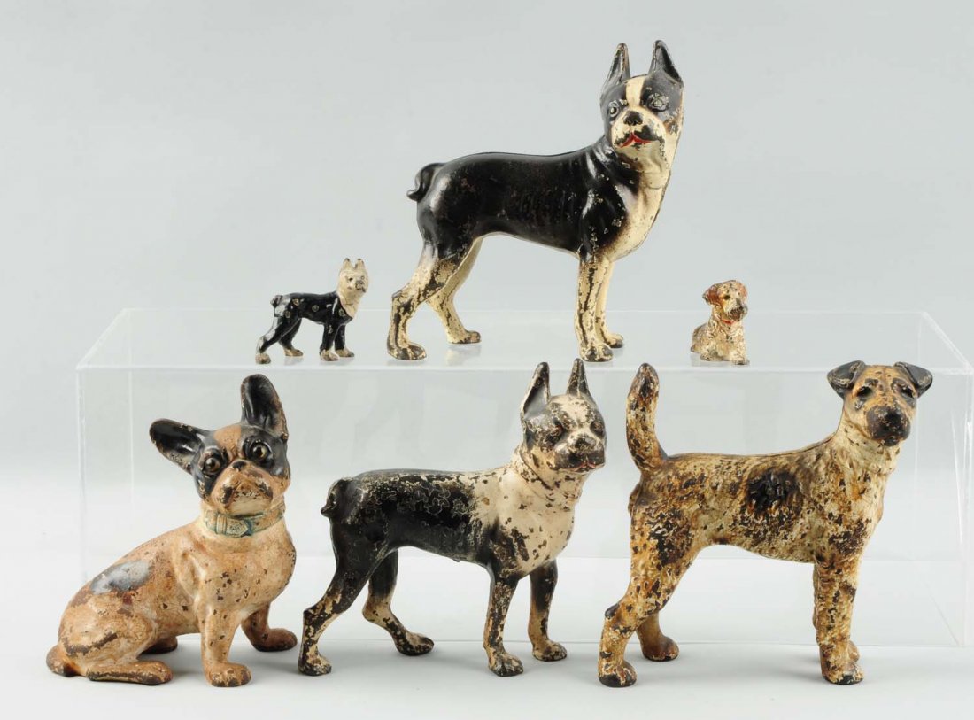 Lot of 6: Cast Iron Dog Doorstops & Paperweights.: Includes four doorstops and two paperweights. Condition (Very Good). Size Largest : 7" L.