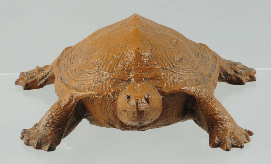 Cast Iron Turtle Doorstop.: Signed "Wilton" Products. Depicts turtle with web feet. Condition (Excellent Plus). Size 2 - 3/4" T.