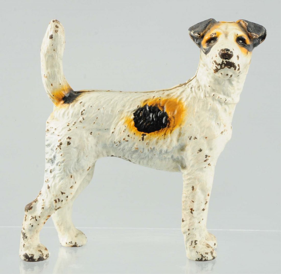 Cast Iron Fox Terrier Dog Doorstop.: Made by Hubley, full-figure. Condition (Excellent). Size 8 - 1/2" T.