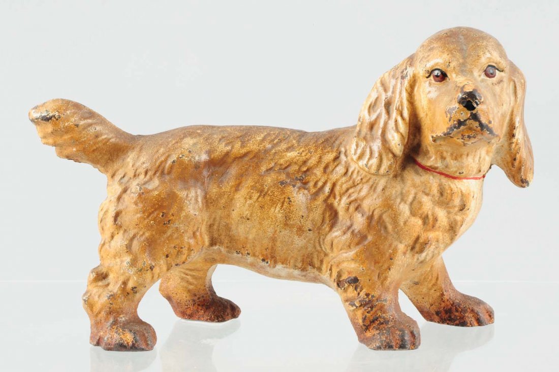 Cast Iron Cocker Spaniel Dog Doorstop.: Made by Hubley, full-figure. Tan color variation. Condition (Very Good). Size 6 - 7/8" T.