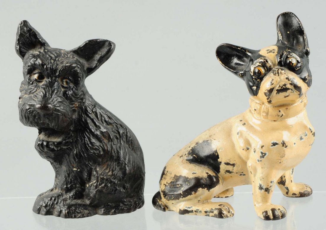Lot of 2: Cast Iron Dog Doorstops.: Includes sitting French Bulldog, Hubley; Also includes sitting Scottie pup, Wilton Products. Condition (Good). Size Largest: 7 - 3/4" T.