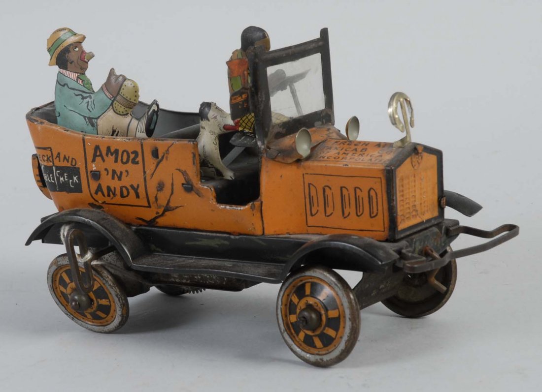 Marx Amos & Andy Tin Wind-up Car.: The car has significant litho loss and scratches throughout and especially to the litho of the wheels. Includes the tin driver, passenger, and dog. Condition (Good - Very Good). Size 8" L .