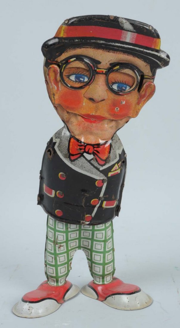 Tin Windup McCarthy Figure.: The toy has some litho scratches throughout, some light oxidation to the bottom of his shoes, and is missing both of his arms. Otherwise, the figure has very nice and bright colors. Condition (Good - 