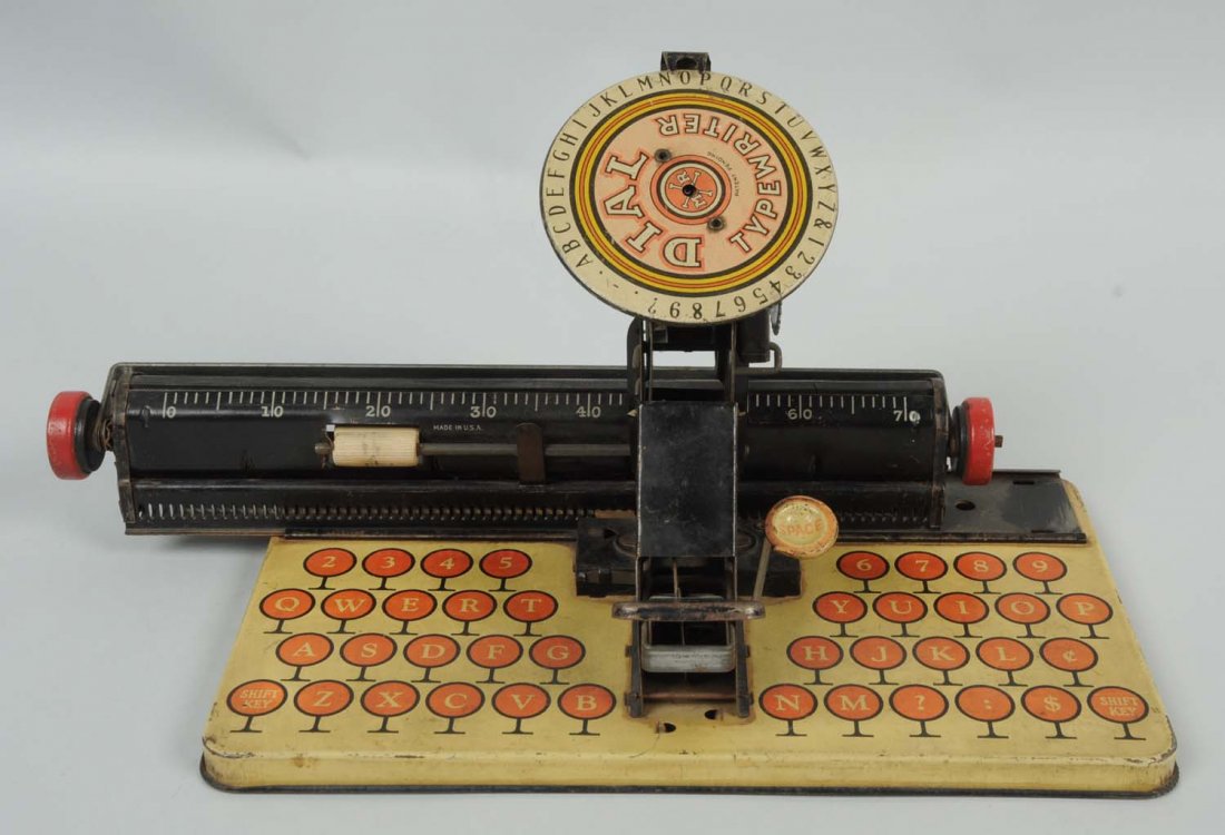 Marx Dial Typewriter Toy.: This toy typewriter has minor paint loss here and there but seems to be in great working order. Condition (Very Good). Size 10" L.