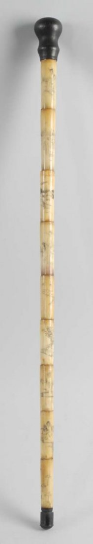 Contemporary Cane with Erotic Images.: Indonesian scrimshawed bone cane with erotic images. The handles in stained hardwood and the bone is camel bone, put together in sections over a solid shaft. Condition (Excellent). Size 34 - 1/2" L.