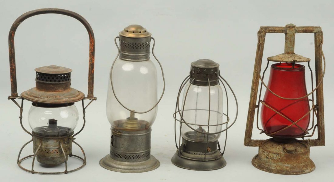 Lot of 4: Assorted Lanterns.: This lot includes an Adlake Railroad lantern, an E. Miller lantern, and two others including one with a red globe. Condition (Very Good). Size Largest : 14" L.