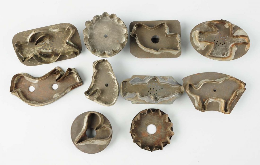 Lot of 10: Tin Cookie Cutters.: This lot includes cutters depicting a bird, a fish, a cat, a bear, and other images. Condition (Very Good). Size Largest : 5" L.