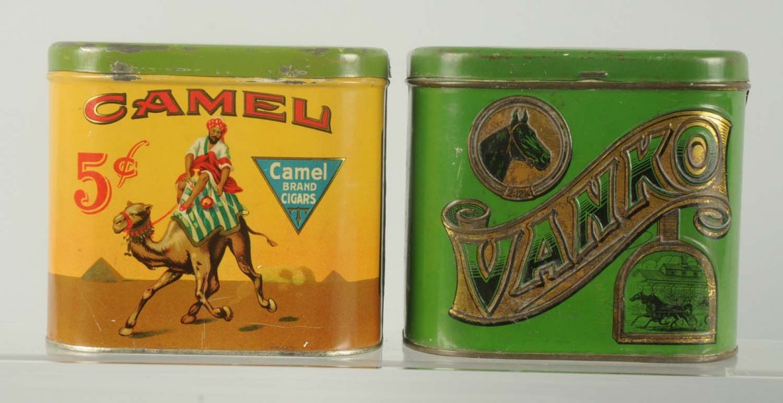 Lot of 2: Tobacco Tins.: Includes Camel which has bright overall colors and shine. Minimal amounts of wear. Also a Vanko with modest amounts of wear and general tarnishing to the gold. Condition (Excellent). Size Each: 5 - 1/