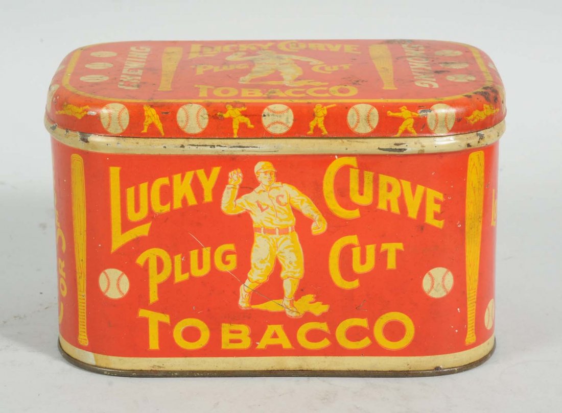 Lucky Curve Lunch Box.: By the Lovell & Buffington Tobacco Company from Covington, Kentucky. Very nice example with solid overall color. Minimal amounts of wear with a bit more soiling and light scratches on the lid. Visuall