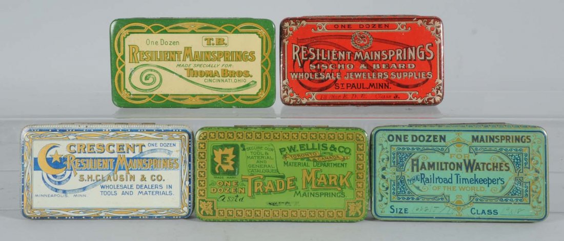 Lot of 6: Mainspring Tins.: Vintage tins with fine graphics; Hamilton Watches, Trade Mark, Crescent, T.B. and Sischo and Beard, manufactured by American Can. Condition (Fine - Near Mint). Size Each: 5 - 1/4" L.