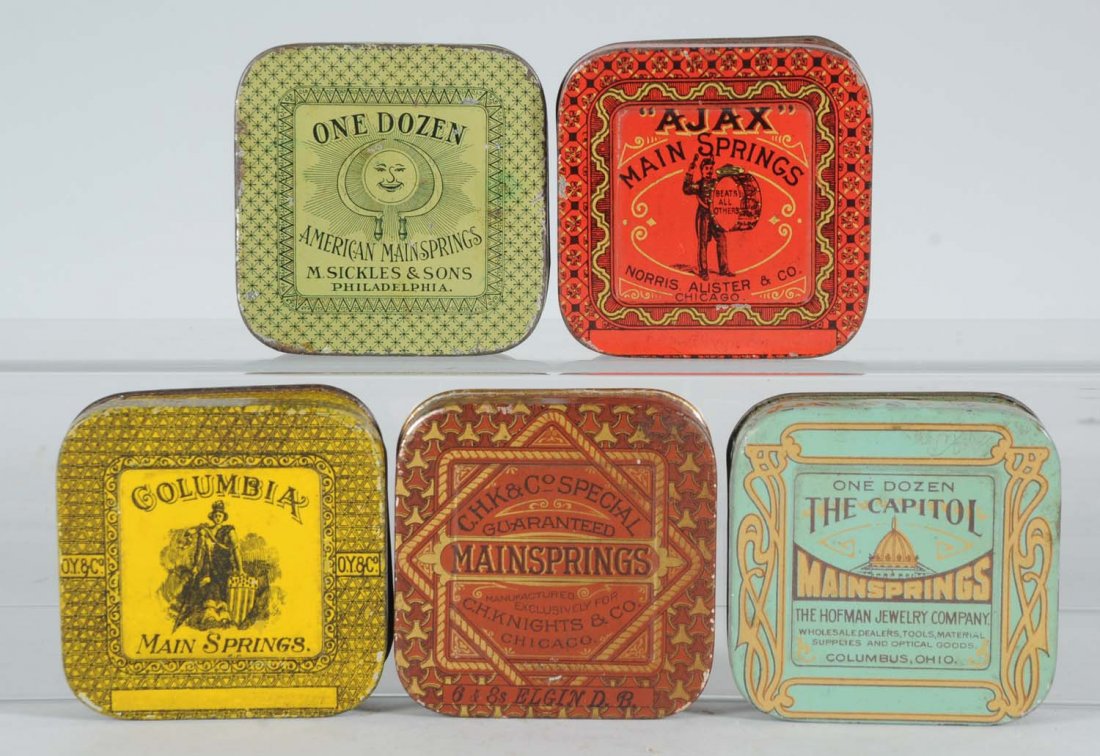Lot of 5: Mainspring Round Corner Tins.: Colorful vintage mainspring tins; Ajax, One Dozen, The Capitol, C.H.K. & Co., Special and Columbia from American Can, Somer Bros. and Haskers & Marcuse Co. Condition (Fine - Fine Plus). Size Each" 3" 