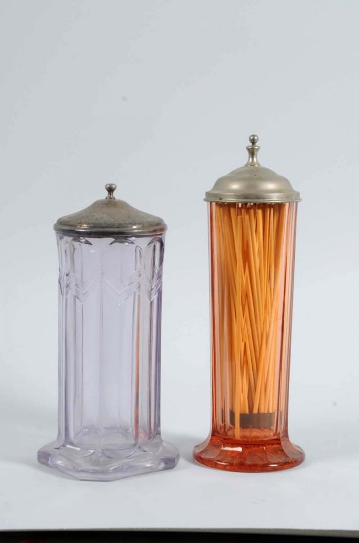 Lot of 2: Lidded Grass Straw Holders.: One holder in this lot is made of pink glass and the other has a very light lavender color. There is some oxidation to the metal lids, but otherwise, no chips, cracks, or damage. Condition (Very Good)