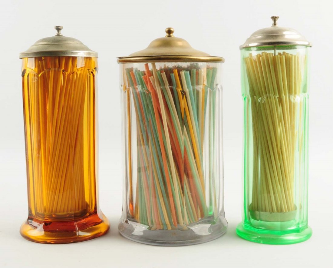 Lot of 3: Early Glass Straw Holders.: All have original metal lids with general plating wear. Very clean trio otherwise. Condition (Excellent). Size Largest: 11 - 1/2" T.