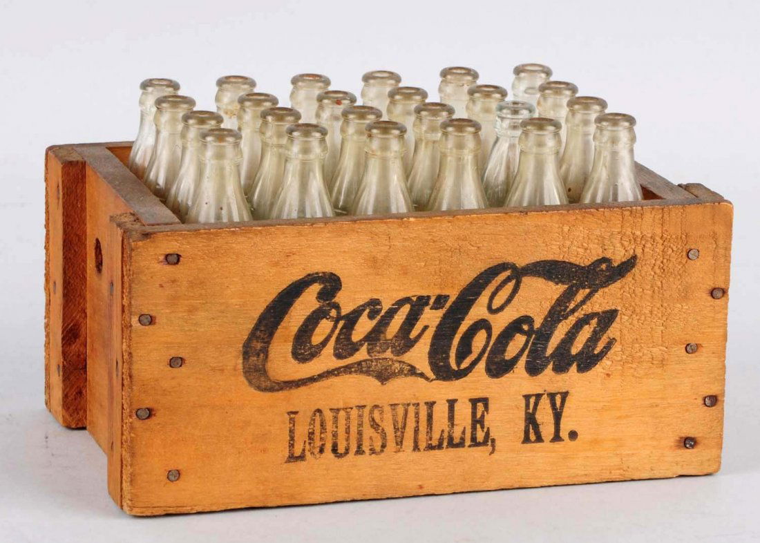 1920's-30's Coca-Cola Miniature Wooden Case.: Includes a full 24 count of small display bottles. Strong stencil on both sides. With only light soiling overall. Condition (Excellent). Size 6" x 3 - 3/4".