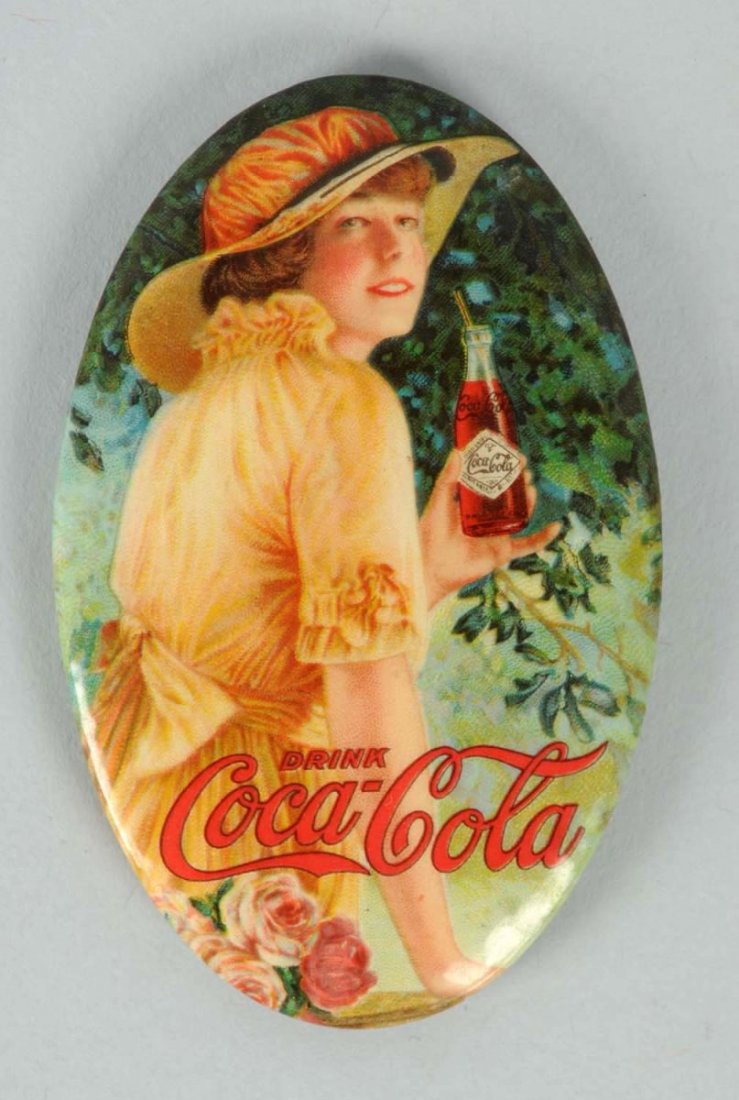 1916 Coca-Cola Pocket Mirror.: Bumpy surface with light wear and soiling. Condition (Excellent). Size 2 - 3/4" T.