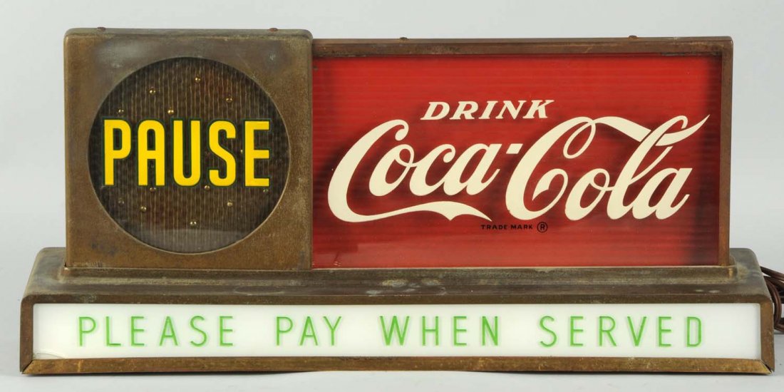 1950's Coca-Cola Pause Lit Motion Sign.: Displays well. With medium lifting but no flaking of lettering of paint. Also, shows typical wear of old gold case wash. Small closed cracks lower left corner of bottom sign plate. Condition (Good - V
