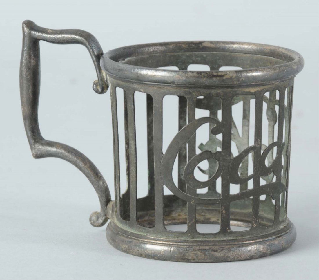 Circa 1905-1910 Coca-Cola Pewter Glass Holder.: Great overall condition with little to no marks or wear and just overall tarnish. Condition (Excellent Plus). Size 3 - 1/2" L.