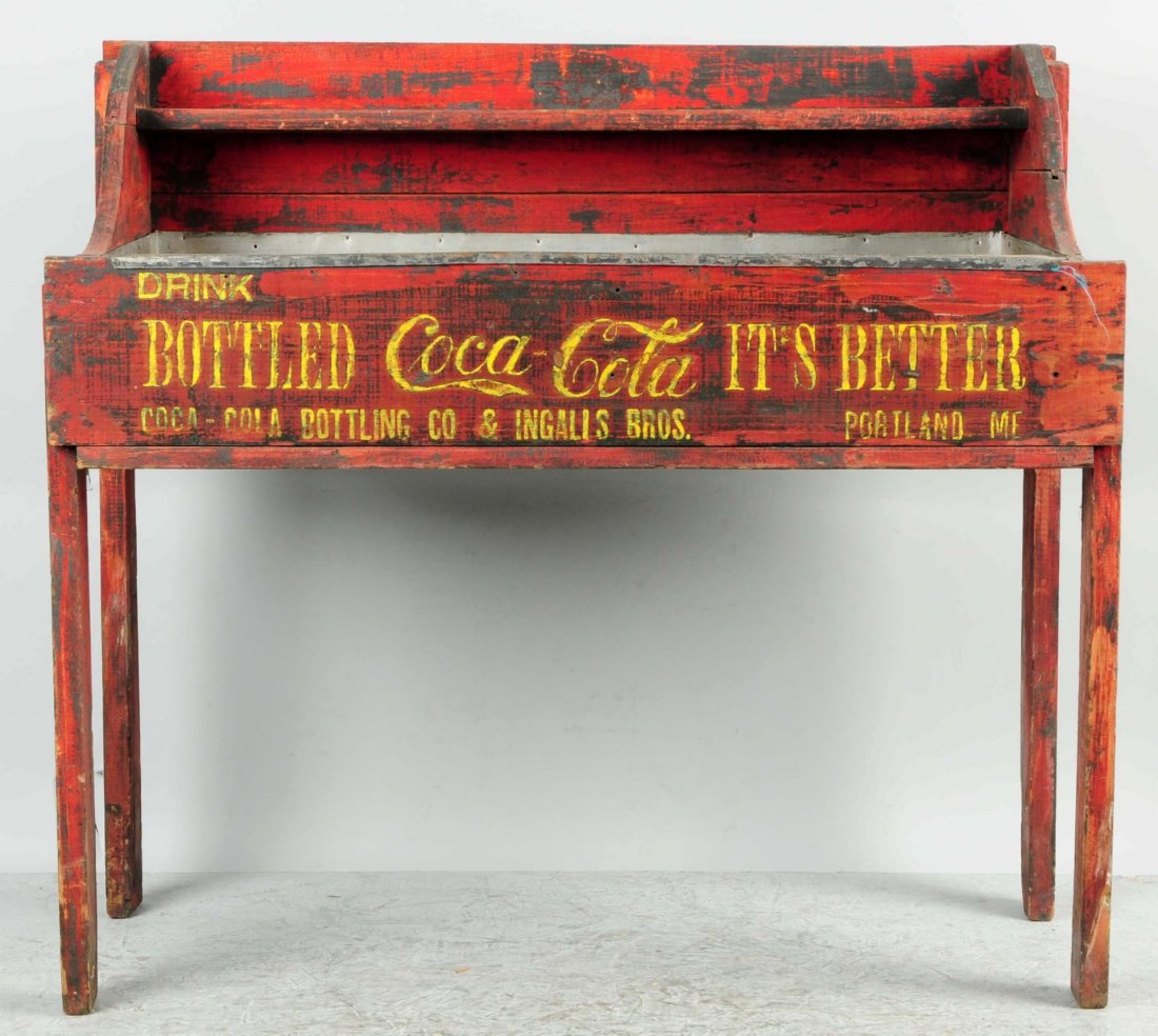 Early & Primitive Coca-Cola Wooden Ice Cooler.: This is a great store item with embossing that reveals it to be from Portland, Maine. The embossing has been re-highlighted in a yellow color. Much of the old original red shows through a later darker