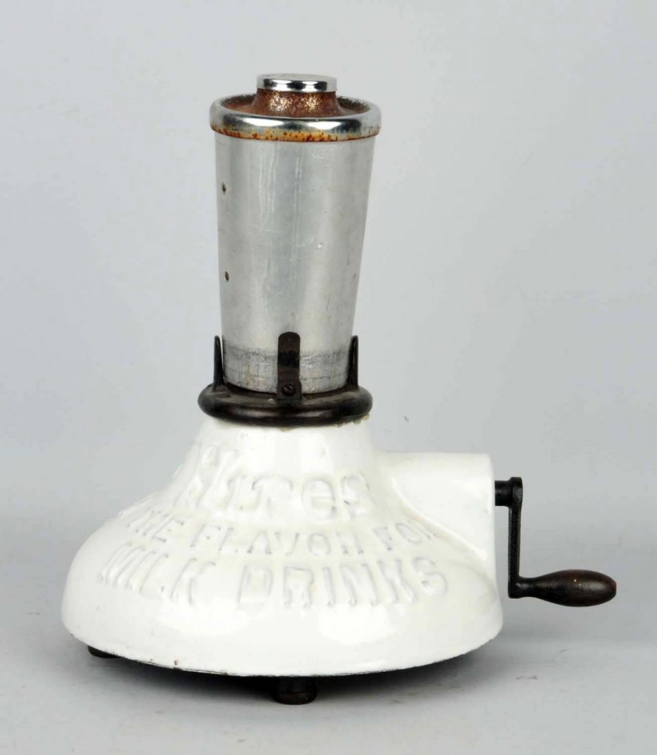 Early & Scarce Hires Milk Shake Mixer.: Hand cranked mechanism on this heavily made porcelain and iron piece. Includes it’s old cup with integrated mixer and lid. Light wear overall with rust on lid. Condition (Excellent). Size 13" T.