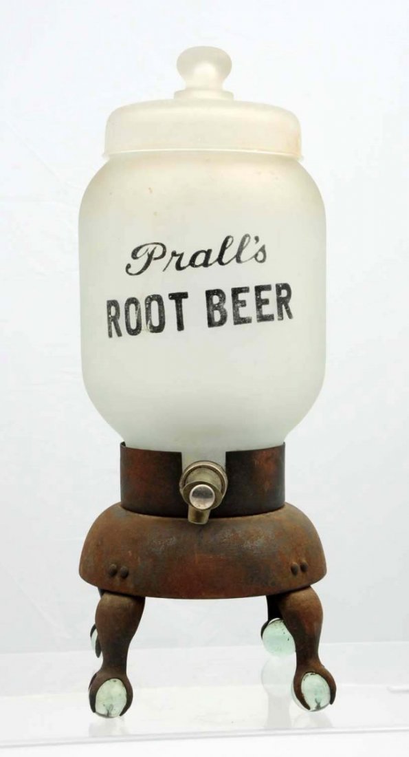 Prall’s Root Beer Frosted Glass Syrup Dispenser.: Complete with original lid and metal claw foot base. Base has rust and lid has a small nick at lip edge. Light wear overall elsewhere. Condition (Very Good). Size 19 - 1/4" T.