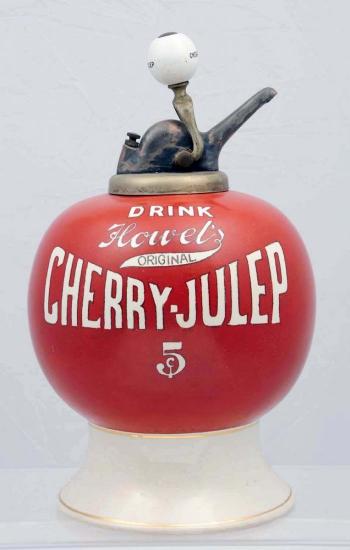 Howell’s Cherry-Julep Syrup Dispenser.: Complete with an old original ball pump marked twice. Clean and sound example with some original factory small spot color retouching and little to no wear. Condition (Near Mint).