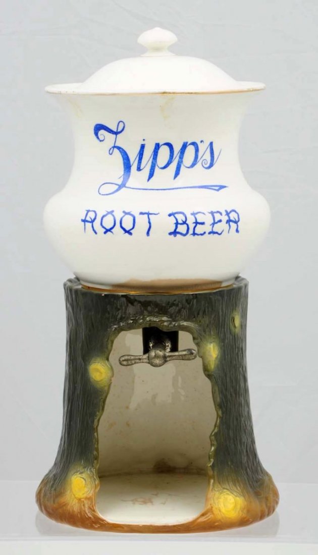 Very Rare Zipp’s Root Beer China Syrup Urn.: C. 1900 and complete and made by and marked Wheeling Pottery. The original lid has a longer hairline and small edge chip. Normal crazing on the china pieces and only mild stains on the figural stump b