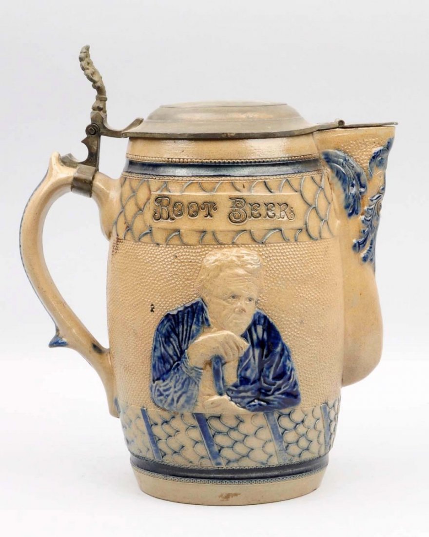 C.1880s Embossed Stoneware Root Beer Picture.: Includes its original pewter lid. Nice item with bold embossing, strong color, only a few minor stains. Condition (Near Mint). Size 12 - 1/2" T.