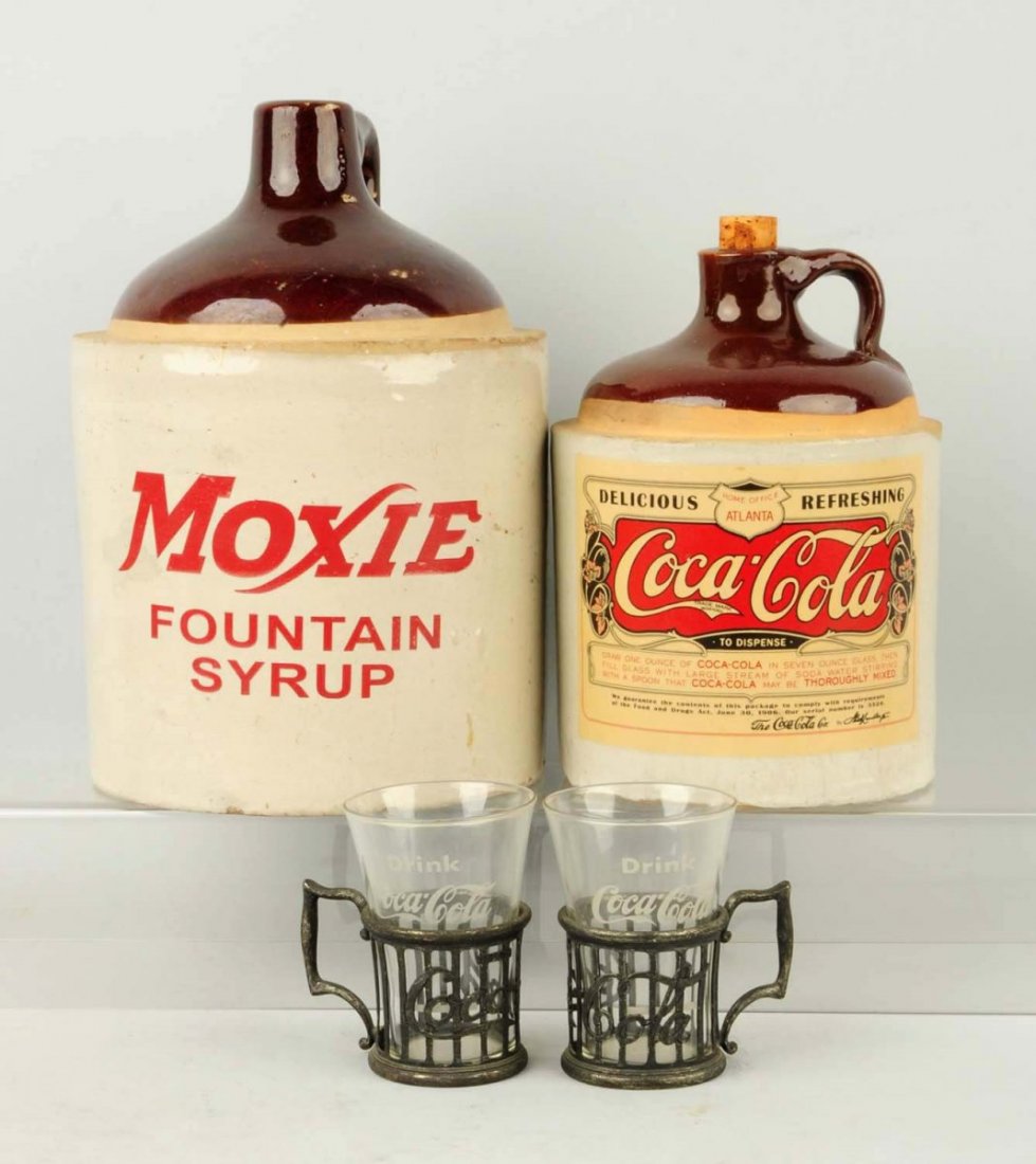 Coca-Cola & Moxie Jugs.: The Moxie jug is old, but not the lettering. The Coke items are all reproductions. Condition (Excellent). Size Largest: 10" T.