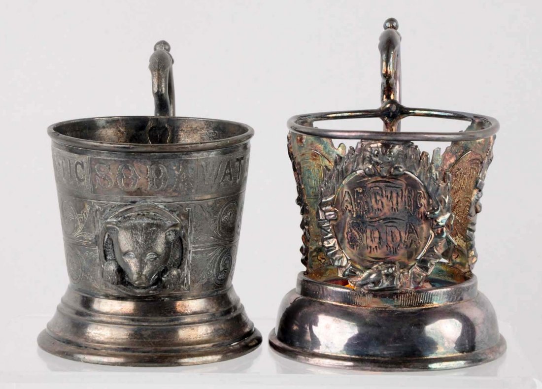 Lot of 2: 1880s Beautiful Glass Holders.: Both are embossed, engraved and highly detailed. Light wear and tarnish only. Condition (Excellent). Size Largest: 5" T.