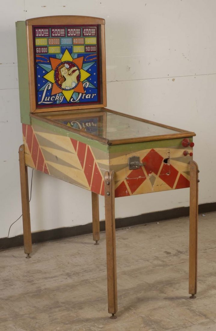 1947 Gottlieb Lucky Star Pinball Machine.: The playfield is good with some wear and lower planking. The backglass is very good with some flaking. The cabinet is good, original, and has scrapes and wood damage. This machine will not power up. P