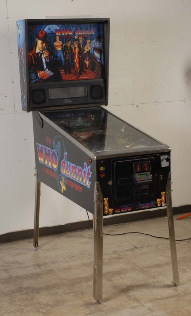 1996 Bally Who Dunnit Pinball Machine.: The playfield is excellent with the nice original finish and nice plastics. the backglass is good and has rub marks through the artwork. The cabinet is good, original, has chips, scrapes, and is drill