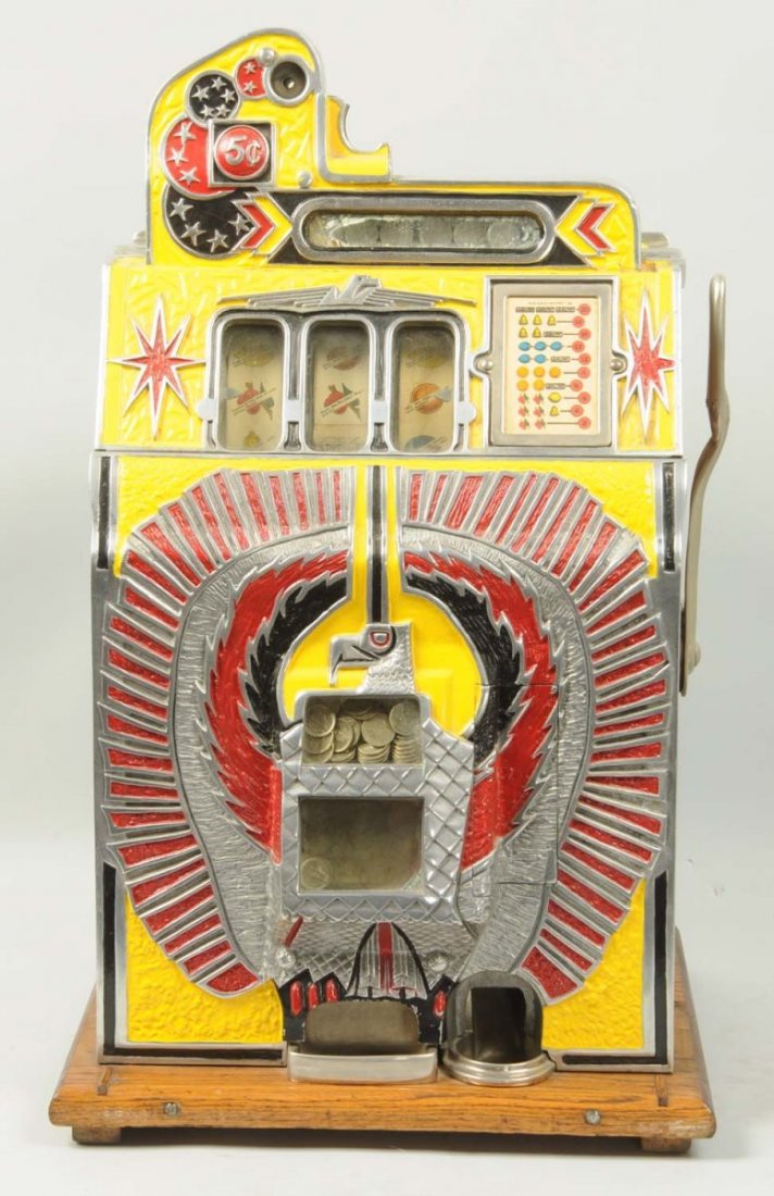 Mill's Novelty Company War Eagle Slot Machine.: Five cent rockola conversion. Complete and all original. Condition (Restored). Size 27" L.