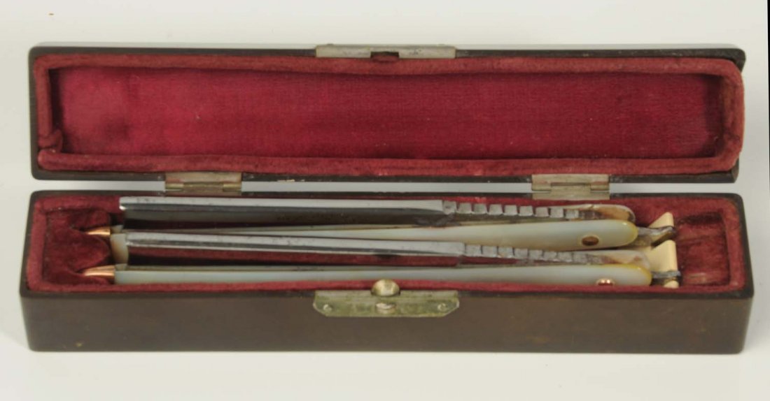 Cased Pair of Pearl Razors with Gold Pique Work.: . Unmarked by probably English, this superb pair features one-piece pearl handles with gold caps on the end, gold escutcheons on the front scales, and approx. 90 gold pins on each handle scale. The re