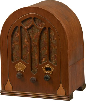 General Electric Wood Tombstone 3-Knob Radio Model K-50: General Electric Wood Tombstone 3-Knob Radio Model K-50 w/Cut-out Grill, Metal Escutcheon On Right & Metal GE Medallion On Left 13.75” x 11.25” x 7.5”.