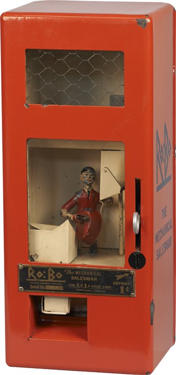 1 Cent Robo Sales Corp. Mechanical Salesman Bulk.: 1 Cent Robo Sales Corp. Mechanical Salesman Bulk Vending Machine, Pat. 1929, Serial No. 1109, Red porcelain wall mount case w/ automaton similar to the Manikin Baker Boy/Scoopy machines. Rare w/ Key.