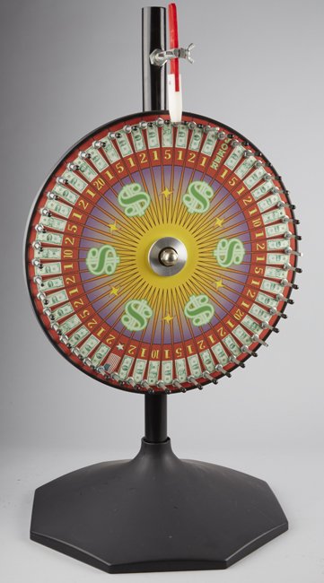 Wheel Of Fortune” Countertop Gambling Wheel.: Wheel Of Fortune Countertop Gambling Wheel On Base, Place your bet on $1, 2, 5, 10, or 20, if wheel stopped on your number, you won Approx. 3’ Tall.