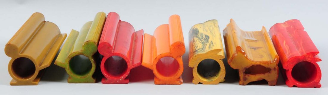 Lot of 7: Bakelite Napkin Ring Rods.: This lot includes four bird rods, two bunny rods, and one Scottie dog rod. The rods are various colors, some have cracks, but overall in good condition. Total weight 2,200 grams. Condition (Good).