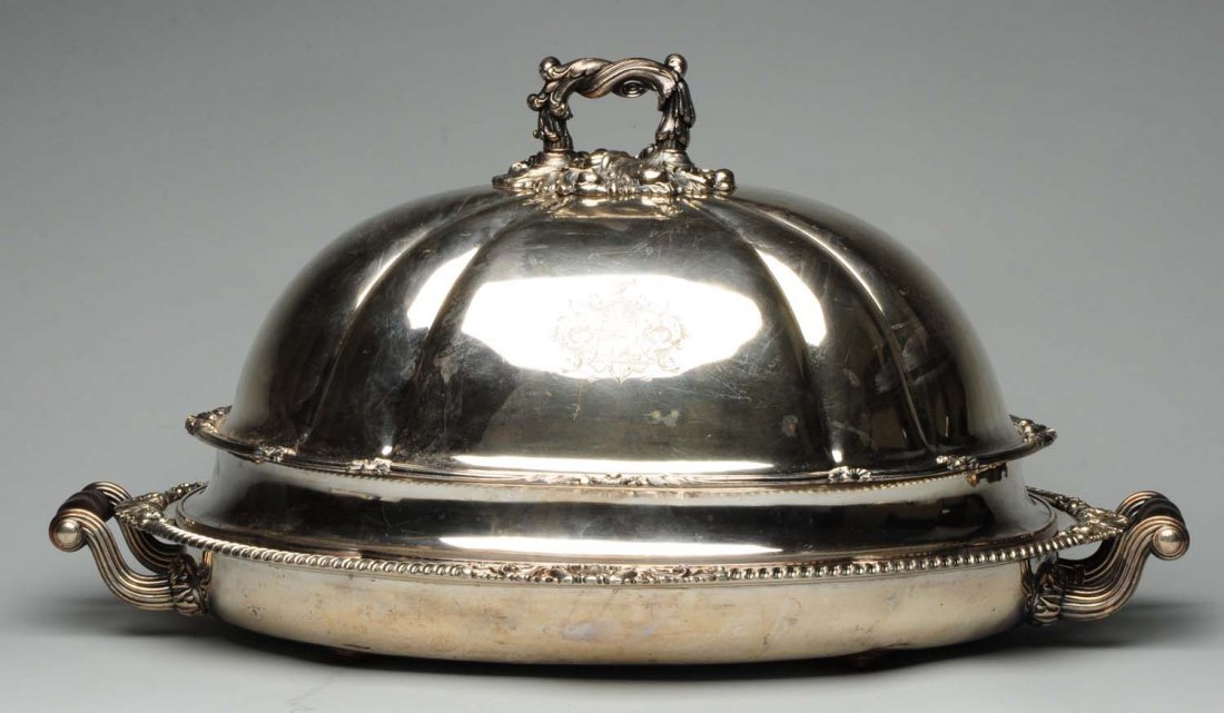 Sheffield Plated Meat Dish and Domed Cover.: Both mid-19thC, the meat dish with a well-and-tree center, a shell, scroll and gadroon edge, two scrolled handles with turned ebony grips, all above a hot water base; the domed cover of usual form wit