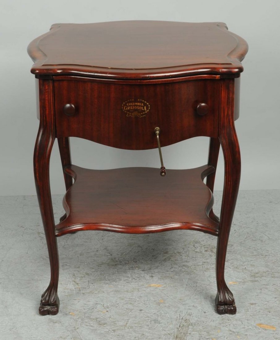 Grafonola Table Phonograph with Claw Feet.: Phonograph is enclosed in what looks like a table. The case is mahogany with a good original finish. The claw feet are in excellent condition. The phonograph winds up and plays good. Condition (Very G
