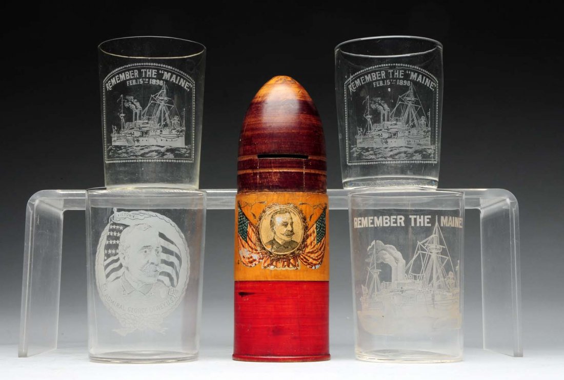 Lot of Admiral George Dewey Items.: Including a Treenware shell bank with Dewey, and four glass etched tumblers with "Remember the Name". Condition (Excellent). Size Largest: 7" T.