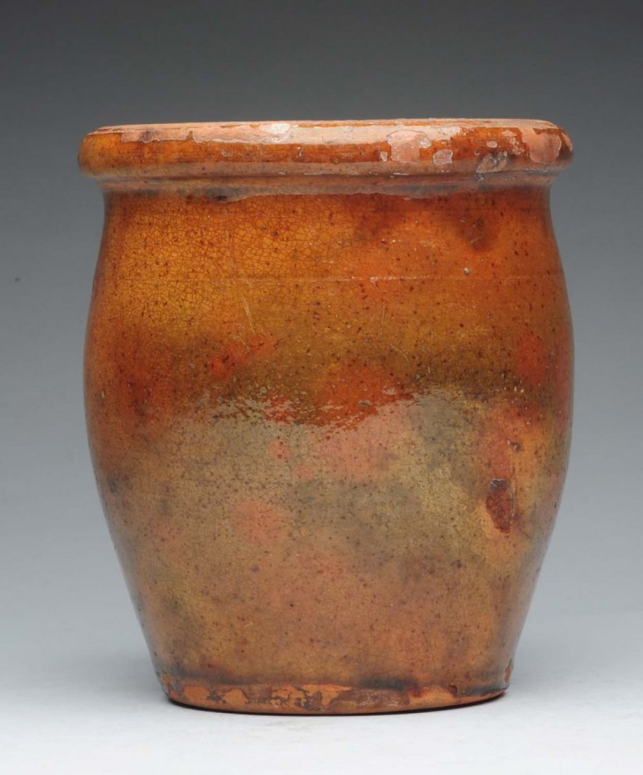 Nice Early Redware Crock.: This nice early crock has a faint single concentric line. Has red and green splotches throughout. One glaze pop. Condition (Very Good). Size 7 -1/2" L.