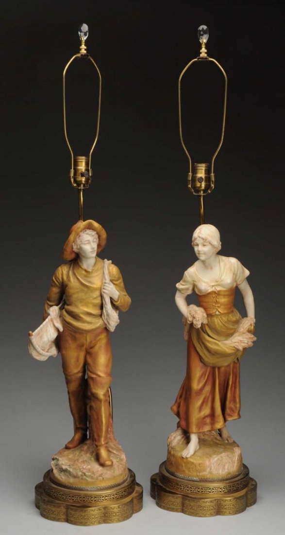 Pair of Ceramic Royal Dux Lamps.: Depicting a young farmer girl and boy. Circa 1910. Condition (Mint). Size Each: 39" T.