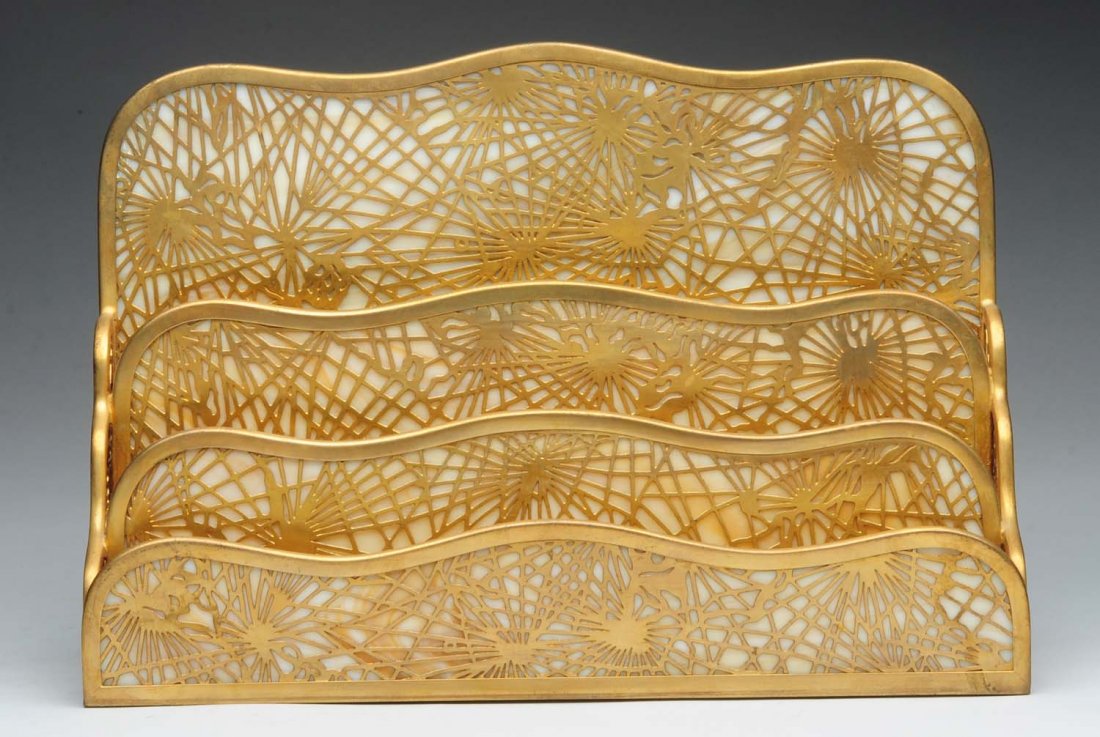Tiffany Studios Pine Needle Large Paper Rack.: Rack No. 1007. Tight crack to back panel and minor wear to the gold. Condition (Good). Size 12" L.
