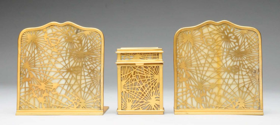 Tiffany Studios Pine Needle Bookend & Card Case.: Double playing card case No. 876 and pair of bookends No. 1024. One bookend glass is cracked, and the ends and box have possibly been restored. Condition (Good - Very Good). Size Largest: 6" T.