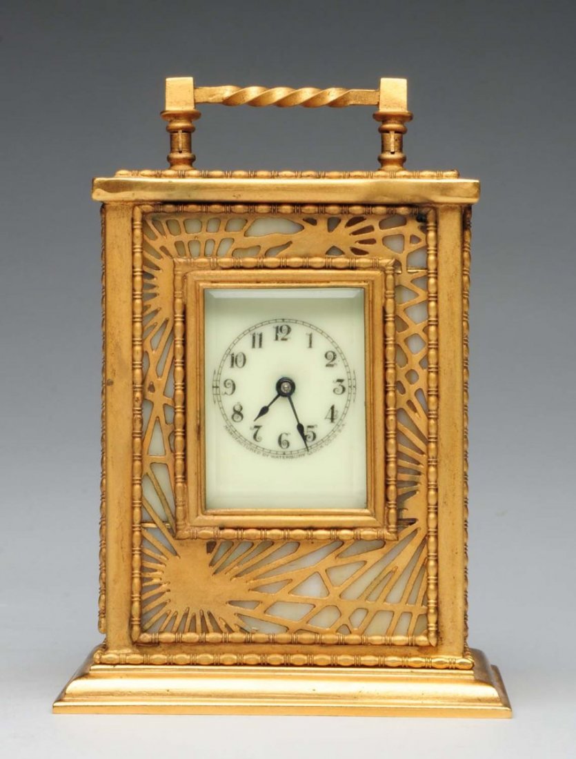 Tiffany Studios Pine Needle Carriage Clock.: The clock is not numbered. There is wear to the gold and the back door has been restored. The clockworks are intact and untested. Condition (Very Good). Size 5" T.