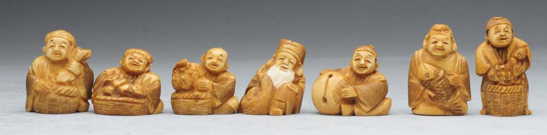 Lot of 7: Japanese Netsukes.: This lot of Netsukes includes a man with a fish, a man with a white beard, and five other images. Condition (Excellent).